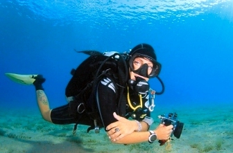 Underwater photographer demonstrating perfect neutral buoyancy